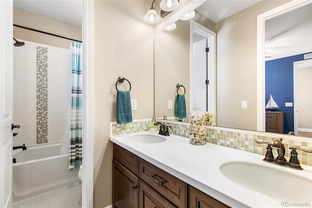 full bathroom featuring vanity, backsplash, shower / bath combination with curtain, and toilet