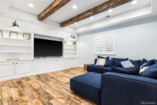 living room with light hardwood / wood-style flooring and built in features