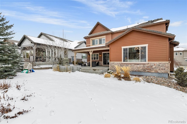 view of snow covered house