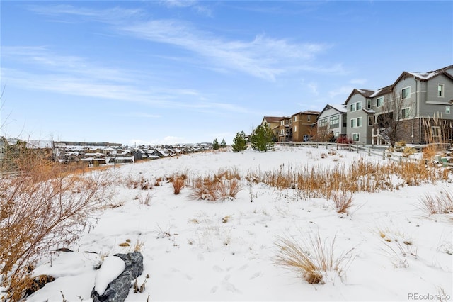 view of yard layered in snow