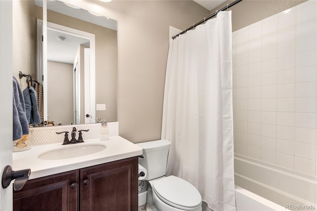 full bathroom featuring vanity, shower / tub combo with curtain, and toilet