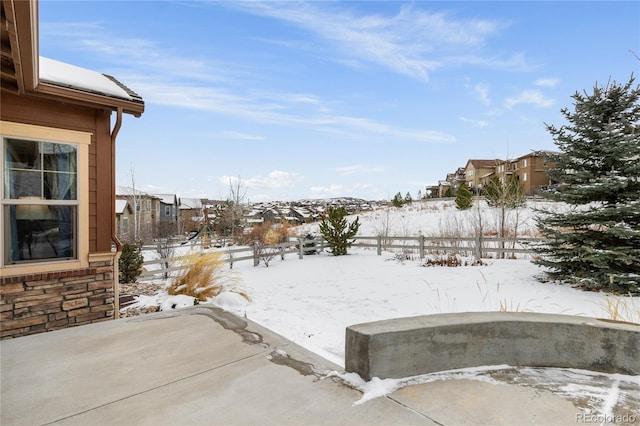 view of yard layered in snow