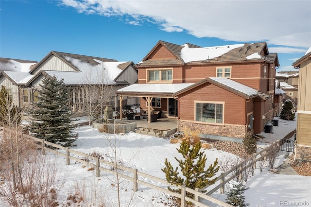 view of snow covered house