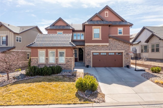 craftsman-style home with a front lawn, an attached garage, stone siding, and driveway