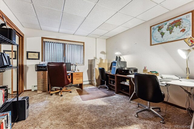 carpeted home office with a drop ceiling and baseboard heating