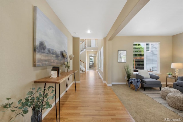 4821 Bluegate Dr, Highlands Ranch, CO 80130 - hallway featuring light wood-type flooring, stairway, baseboards, and recessed lighting
