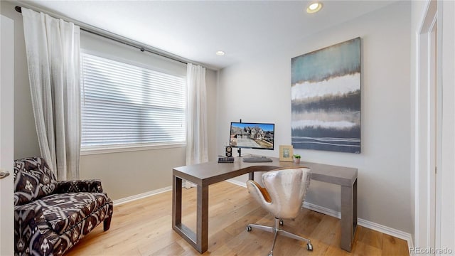 office space with recessed lighting, wood finished floors, and baseboards