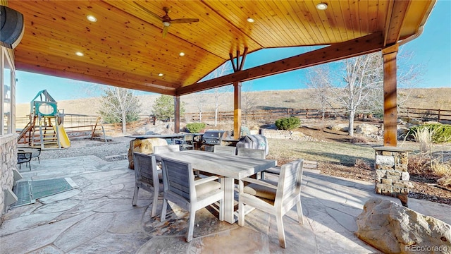 view of patio / terrace featuring outdoor dining space and a playground