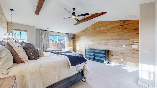 bedroom featuring wooden walls, vaulted ceiling with beams, visible vents, and carpet floors