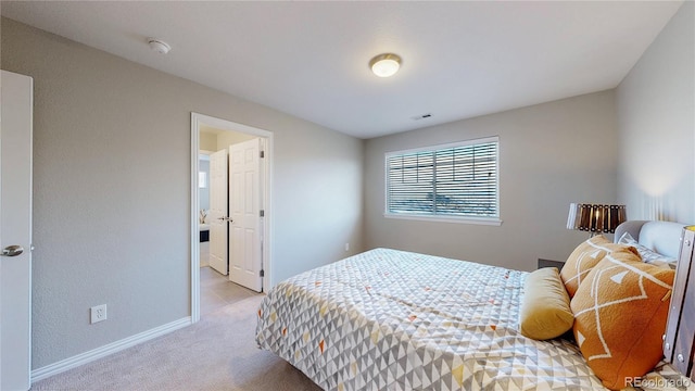 bedroom featuring light carpet, visible vents, and baseboards