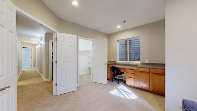 office space with recessed lighting, visible vents, light carpet, and baseboards