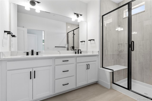223 Washington St, Erie, CO 80516 - bathroom featuring a shower stall and double vanity