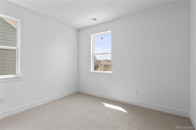 223 Washington St, Erie, CO 80516 - spare room featuring light colored carpet and baseboards