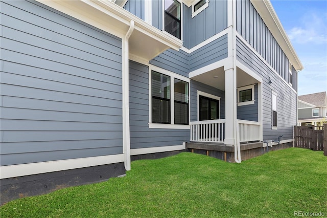 223 Washington St, Erie, CO 80516 - rear view of property with board and batten siding and a porch