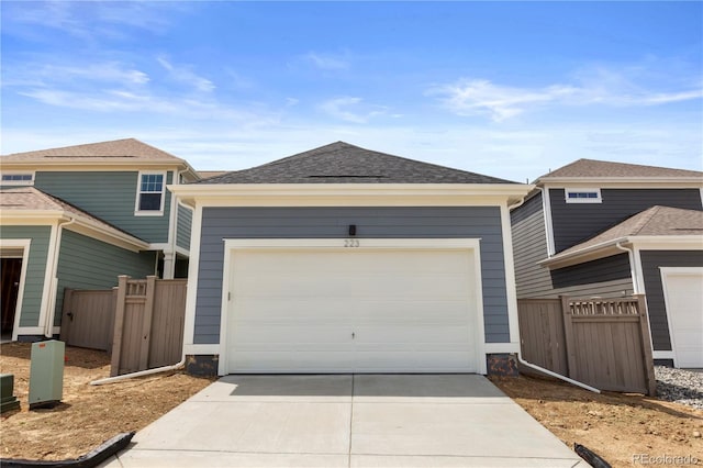 223 Washington St, Erie, CO 80516 - view of front of home featuring driveway and fence