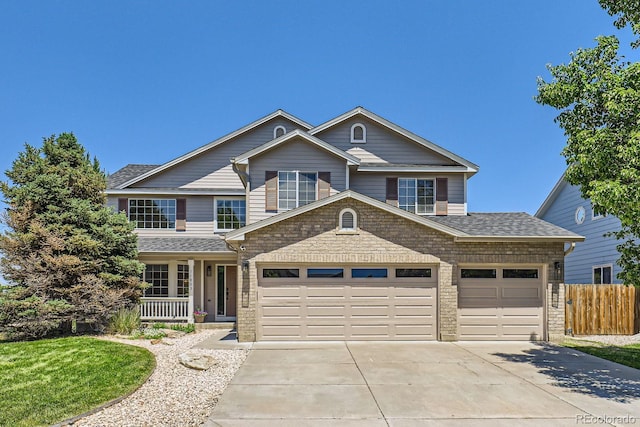 11803 E 114th Pl, Commerce City, CO 80640 - traditional-style home with driveway, an attached garage, covered porch, a shingled roof, and brick siding