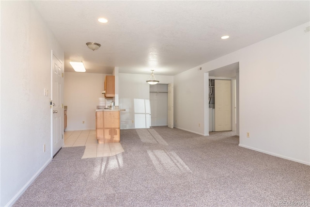 unfurnished living room with light carpet