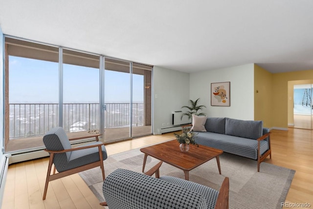 955 Eudora St Unit 1106, Denver, CO 80220 - living area with light wood-type flooring, a baseboard radiator, and a wall of windows
