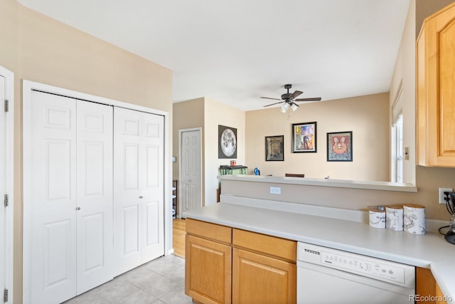 kitchen featuring light tile patterned floors, ceiling fan, white dishwasher, light brown cabinets, and light countertops