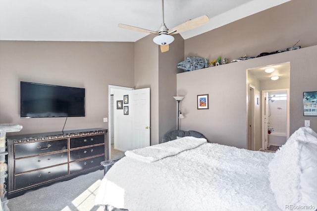 carpeted bedroom with lofted ceiling, ceiling fan, and connected bathroom