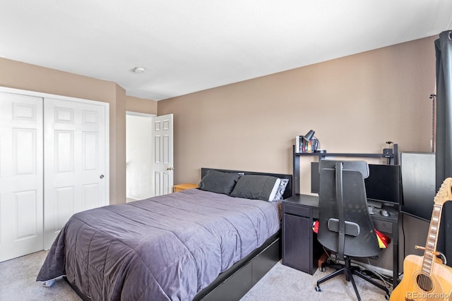 bedroom with light carpet and a closet