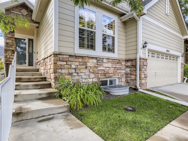 view of home's exterior with a garage, driveway, and stone siding