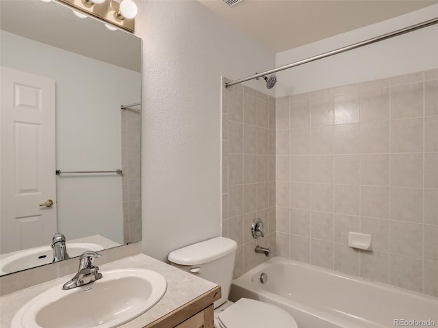 bathroom with vanity, shower / bathing tub combination, and toilet