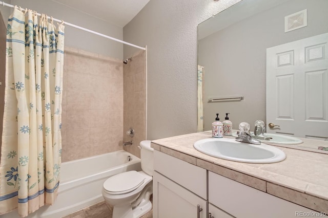 full bathroom with shower / bath combination with curtain, toilet, and vanity