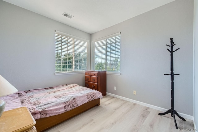 22580 E Ontario Dr Unit 202, Aurora, CO 80016 - bedroom featuring light wood-style flooring and baseboards
