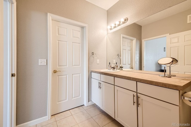 bathroom featuring vanity and tile patterned flooring