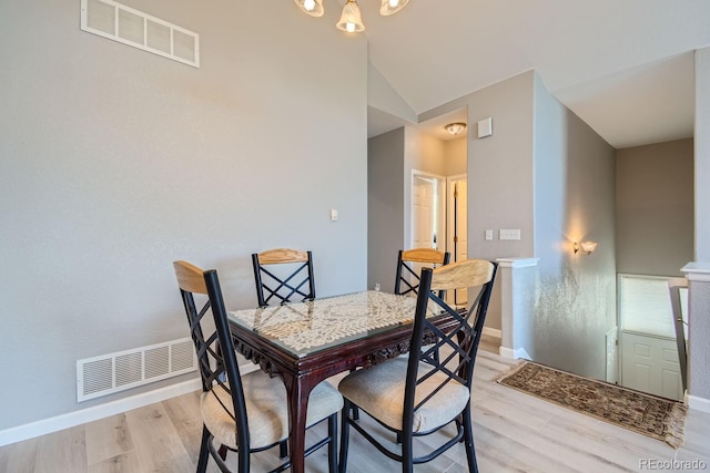22580 E Ontario Dr Unit 202, Aurora, CO 80016 - dining space with light wood-style floors, baseboards, and vaulted ceiling