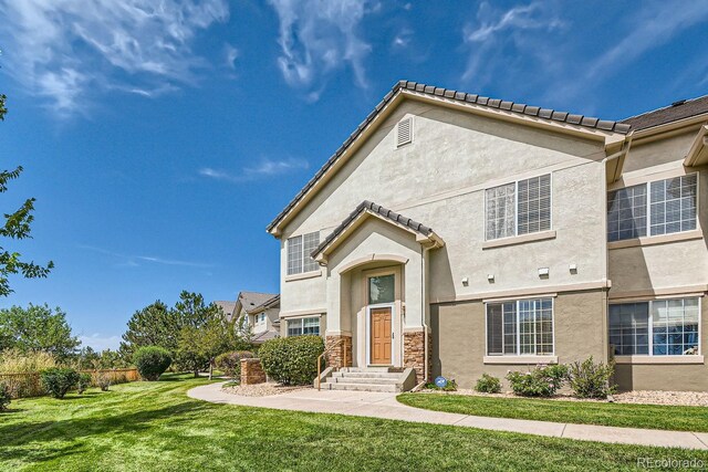 view of front of home with a front yard