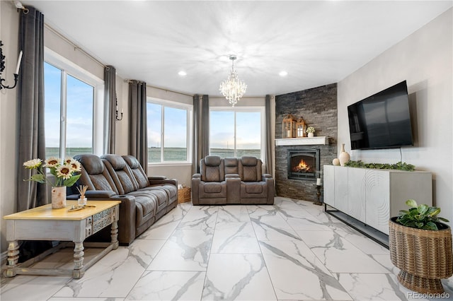 942 S County Road 129th Rd, Bennett, CO 80102 - living room featuring an inviting chandelier, a fireplace, recessed lighting, and marble finish floor
