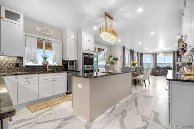 942 S County Road 129th Rd, Bennett, CO 80102 - kitchen featuring an inviting chandelier, decorative backsplash, recessed lighting, white cabinetry, and appliances with stainless steel finishes