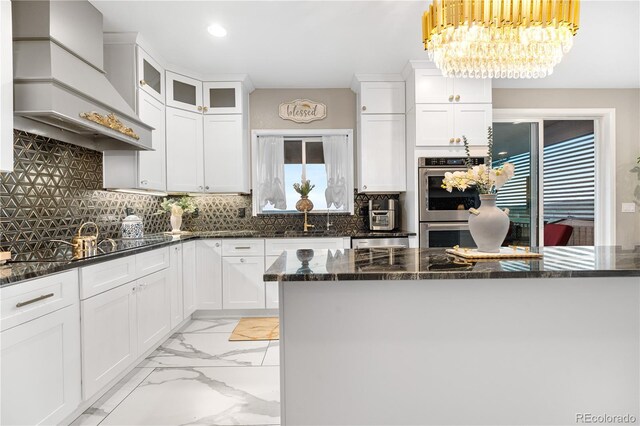 942 S County Road 129th Rd, Bennett, CO 80102 - kitchen with decorative backsplash, white cabinets, and premium range hood