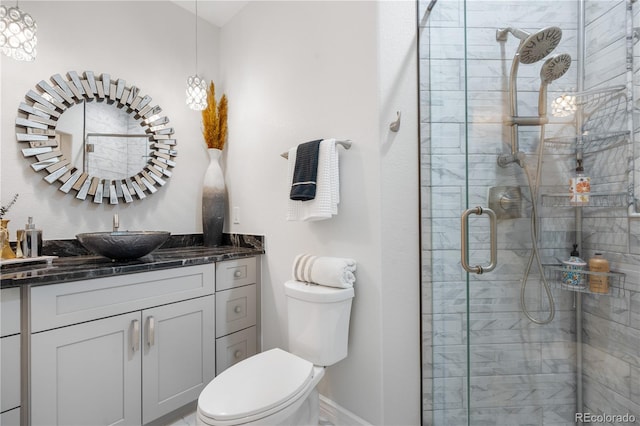 942 S County Road 129th Rd, Bennett, CO 80102 - full bath featuring vanity, toilet, baseboards, and a stall shower