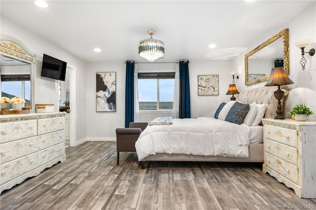 942 S County Road 129th Rd, Bennett, CO 80102 - bedroom with baseboards, recessed lighting, and wood finished floors