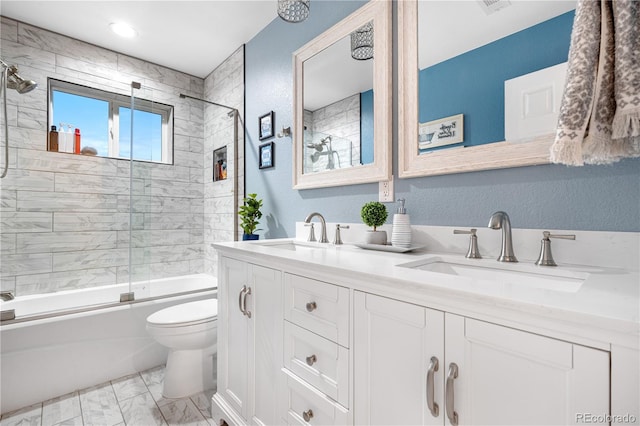 942 S County Road 129th Rd, Bennett, CO 80102 - full bathroom featuring shower / bath combination with glass door, a sink, double vanity, toilet, and marble finish floor