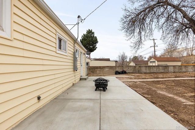 view of patio / terrace with a fenced backyard and a fire pit