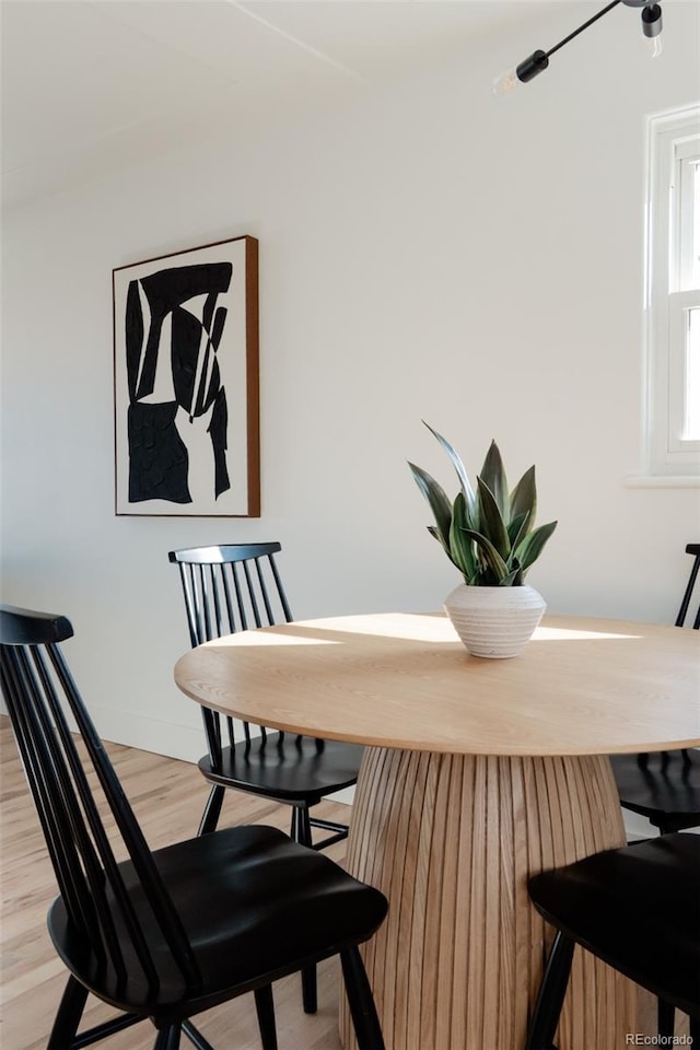 dining area featuring light wood-style flooring