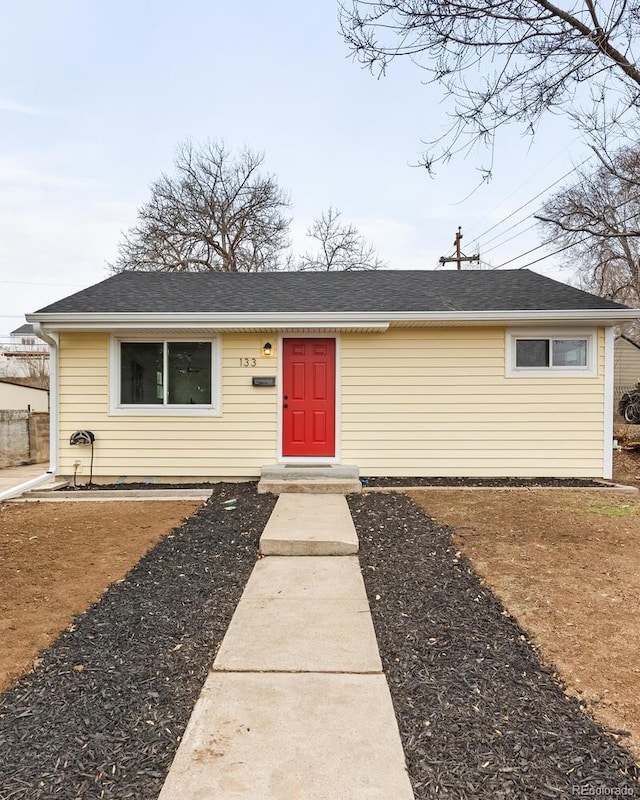 view of front of home featuring roof with shingles