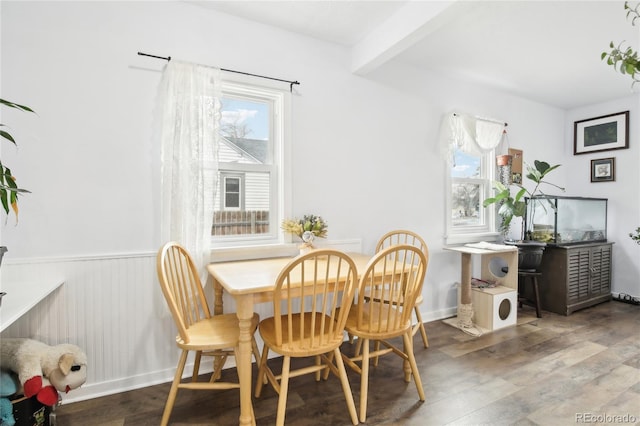 dining area with wainscoting and wood finished floors