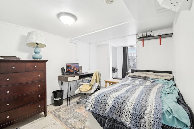 bedroom featuring light wood-style flooring