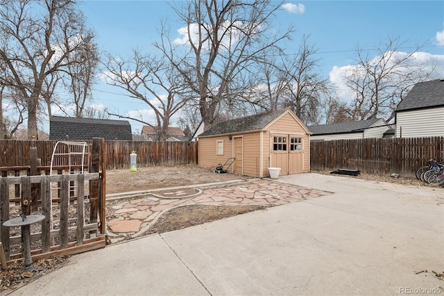 exterior space featuring an outbuilding and a fenced backyard