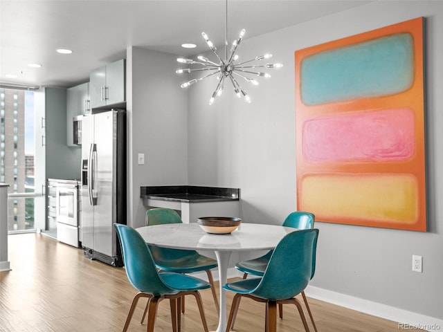 891 14th St Unit 2505, Denver, CO 80202 - dining area featuring wood finished floors, a chandelier, baseboards, floor to ceiling windows, and recessed lighting