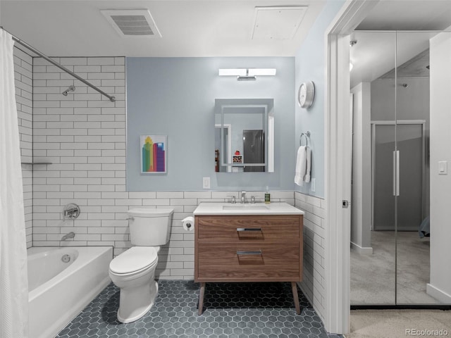 891 14th St Unit 2505, Denver, CO 80202 - full bath featuring tile walls, vanity, shower / bath combination with curtain, toilet, and wainscoting