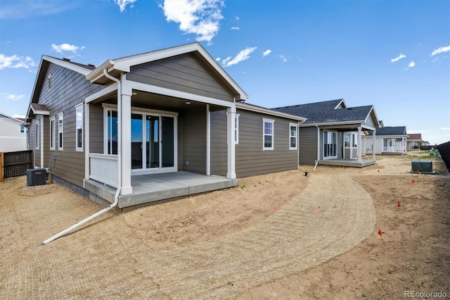 19040 E 96th Pl, Commerce City, CO 80022 - rear view of house with central AC and covered porch