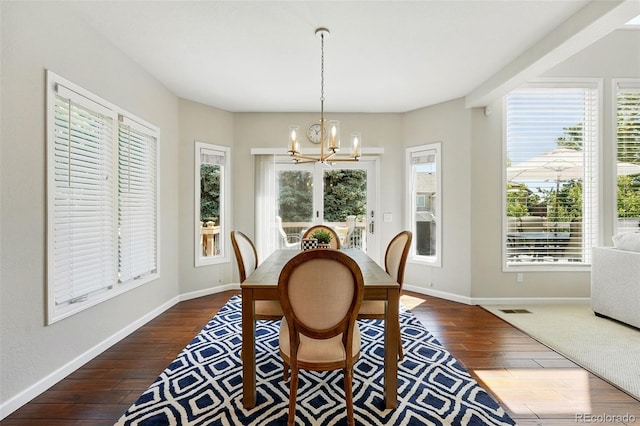 9556 Kemper Dr, Lone Tree, CO 80124 - dining space featuring a chandelier and dark wood-style flooring