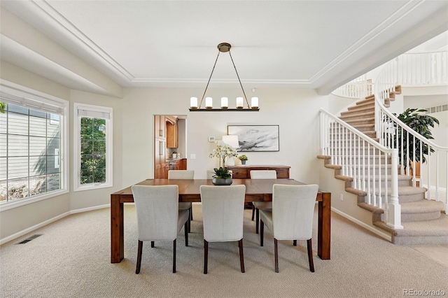 9556 Kemper Dr, Lone Tree, CO 80124 - carpeted dining space with stairs and a chandelier