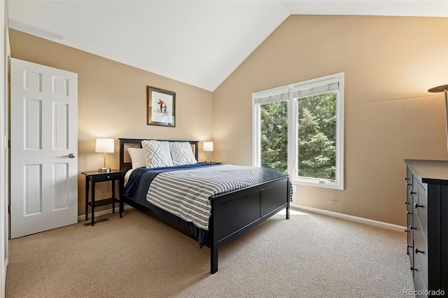9556 Kemper Dr, Lone Tree, CO 80124 - carpeted bedroom featuring lofted ceiling and baseboards